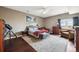 Spacious bedroom with sitting area and large windows at 7905 Schumaker Rd, Bennett, CO 80102