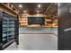 Gun room with metal and wood accents and safe at 7905 Schumaker Rd, Bennett, CO 80102