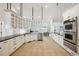 Large kitchen with white cabinets, granite counters, and stainless steel appliances at 7905 Schumaker Rd, Bennett, CO 80102