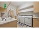 Convenient laundry room with washer, dryer, and sink at 7905 Schumaker Rd, Bennett, CO 80102