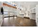 Spacious living room featuring hardwood floors and high ceilings at 7905 Schumaker Rd, Bennett, CO 80102