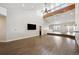 Open living room with hardwood floors and high ceilings at 7905 Schumaker Rd, Bennett, CO 80102