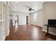 Home office with built-in shelving and wood floors at 7905 Schumaker Rd, Bennett, CO 80102