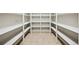 Walk-in pantry with ample shelving for storage at 7905 Schumaker Rd, Bennett, CO 80102