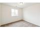 Comfortable bedroom featuring carpet and a window for natural light and ventilation at 5780 N Killarney Way, Aurora, CO 80019