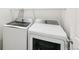 Laundry area with modern, front-loading washer and dryer units, maximizing efficiency at 5780 N Killarney Way, Aurora, CO 80019