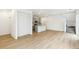 Spacious living room with wood flooring, white walls, recessed lighting, and an open floor plan at 5780 N Killarney Way, Aurora, CO 80019