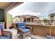 Spacious balcony with comfortable seating and wrought iron railings offering a view of the neighborhood at 800 Rockhurst Dr # D, Highlands Ranch, CO 80129