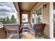 Cozy balcony with outdoor seating, a colorful rug, and string lights for a relaxing atmosphere at 800 Rockhurst Dr # D, Highlands Ranch, CO 80129