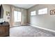 Neutral bedroom offering plenty of natural light and versatile space at 800 Rockhurst Dr # D, Highlands Ranch, CO 80129