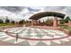 Rose Pavilion with checkered stage, picnic tables, and manicured landscaping at 800 Rockhurst Dr # D, Highlands Ranch, CO 80129