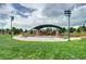 Outdoor Case Pavilion featuring a checkered stage, lighting, and ample seating at 800 Rockhurst Dr # D, Highlands Ranch, CO 80129