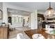 Open-concept dining area with hardwood floors and seamless flow at 800 Rockhurst Dr # D, Highlands Ranch, CO 80129