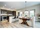 Bright eat-in kitchen featuring dark cabinets, a stylish island with bar seating, and wood-look floors at 800 Rockhurst Dr # D, Highlands Ranch, CO 80129