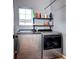 Laundry area equipped with modern appliances and shelving for storage at 800 Rockhurst Dr # D, Highlands Ranch, CO 80129