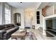 Inviting living room with hardwood floors, a stylish mirror, and a comfortable couch at 800 Rockhurst Dr # D, Highlands Ranch, CO 80129