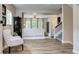 Bright and airy living room with hardwood floors and staircase at 800 Rockhurst Dr # D, Highlands Ranch, CO 80129