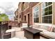 Relaxing outdoor patio with comfortable seating, a fire pit, and a stylish rug at 800 Rockhurst Dr # D, Highlands Ranch, CO 80129