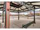 Town Center view from shelter, showcasing clock tower and shopping district at 800 Rockhurst Dr # D, Highlands Ranch, CO 80129