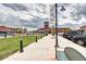 View of Town Center with sidewalks, storefronts, and clock tower on a cloudy day at 800 Rockhurst Dr # D, Highlands Ranch, CO 80129