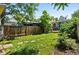 Lawn with stone walkway, wooden fence, and landscaping at 361 Elati St, Denver, CO 80223
