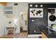 Bright kitchen features black countertops, a chalkboard wall, world map art, and modern appliances at 361 Elati St, Denver, CO 80223