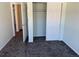 A view of a bedroom with large closet doors at 7777 S Biloxi Way, Aurora, CO 80016