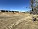 Scenic view of golf course homes offering a tranquil setting and picturesque views in a desirable neighborhood at 7777 S Biloxi Way, Aurora, CO 80016