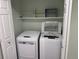A view of the laundry room with full washer and dryer at 7777 S Biloxi Way, Aurora, CO 80016