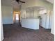 The living area connects seamlessly with kitchen, complemented by vaulted ceilings and creating a comfortable flow at 7777 S Biloxi Way, Aurora, CO 80016