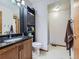 Basement bathroom with a large vanity and shower at 9485 W 81St Ave # B, Arvada, CO 80005