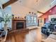 Living room featuring hardwood floors, a brick fireplace, and large windows at 9485 W 81St Ave # B, Arvada, CO 80005