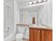 Functional bathroom featuring a shower-tub combo, ample vanity space, and a large mirror at 8943 Tappy Toorie Cir, Highlands Ranch, CO 80129