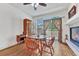 Cozy dining area with hardwood floors, natural light, and easy access to the outdoor balcony at 8943 Tappy Toorie Cir, Highlands Ranch, CO 80129
