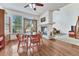 Inviting dining area with hardwood floors, natural light, and seamless connection to living spaces at 8943 Tappy Toorie Cir, Highlands Ranch, CO 80129