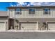 Townhome featuring attached garages and neutral colors at 8943 Tappy Toorie Cir, Highlands Ranch, CO 80129