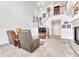 Spacious living room featuring a fireplace, staircase, and comfortable seating arrangement at 8943 Tappy Toorie Cir, Highlands Ranch, CO 80129