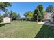 The backyard is spacious, flat, and includes a shed and patio area at 6436 S Kline St, Littleton, CO 80127