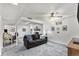 Inviting basement living area with gray carpet, comfy seating, and view of fireplace at 6436 S Kline St, Littleton, CO 80127