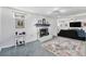 Basement space with fireplace, carpeted floor, and a view into adjacent open living area at 6436 S Kline St, Littleton, CO 80127