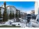 Landscaped backyard with water feature and rocking chairs at 6437 Saddlesmith St, Castle Pines, CO 80108