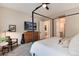 Main bedroom with a dresser and en-suite bathroom access at 6437 Saddlesmith St, Castle Pines, CO 80108