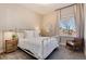 Bright bedroom with white metal bed frame and neutral decor at 6437 Saddlesmith St, Castle Pines, CO 80108