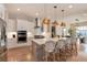 Modern kitchen with stainless steel appliances and island at 6437 Saddlesmith St, Castle Pines, CO 80108