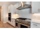 Modern kitchen with stainless steel appliances and white cabinets at 6437 Saddlesmith St, Castle Pines, CO 80108