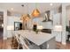 Modern kitchen with stainless steel appliances and island at 6437 Saddlesmith St, Castle Pines, CO 80108