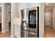 Modern kitchen with stainless steel appliances and white cabinets at 6437 Saddlesmith St, Castle Pines, CO 80108