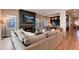 Open floor plan living room with built-in shelving and a modern fireplace at 6437 Saddlesmith St, Castle Pines, CO 80108