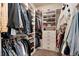 Large walk-in closet with ample hanging and shelving space at 6437 Saddlesmith St, Castle Pines, CO 80108