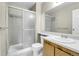 Bathroom with glass enclosed shower, mirror, and white toilet at 18302 E Kepner Pl # 207, Aurora, CO 80017